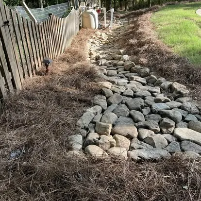 Dry creek bed drainage installation Oxford MS