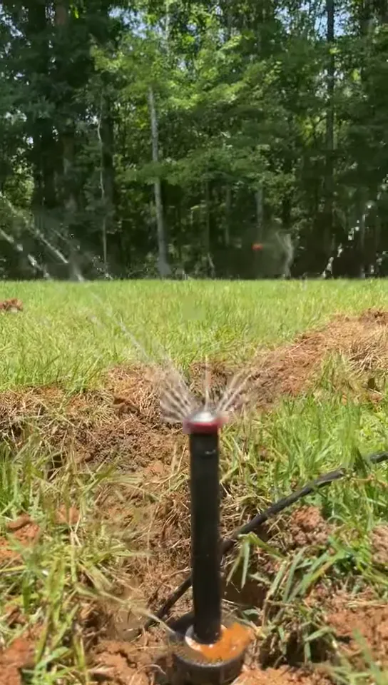 Oxford Lawn Pro sprinkler head running during a new irrigation install in Oxford, MS