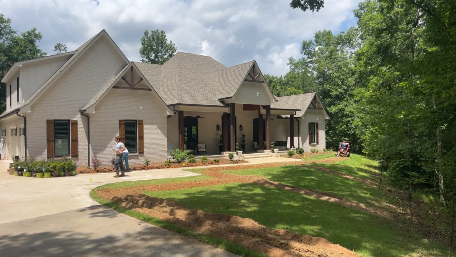 Whole-property irrigation install on a new-build home in Oxford, MS by Oxford Lawn Pro, with fresh sod and trenched supply lines